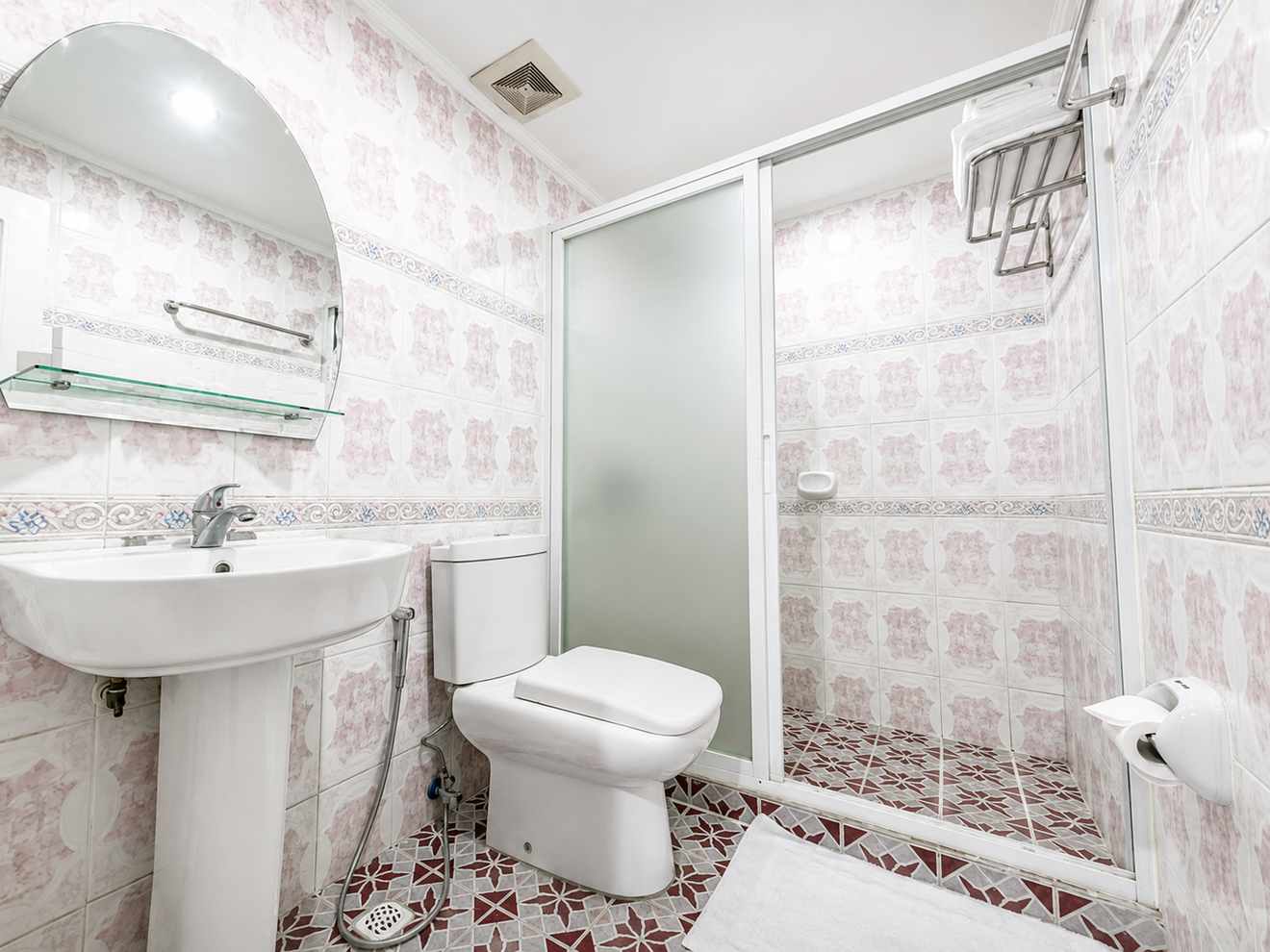 Private bathroom with shower enclosure and sink